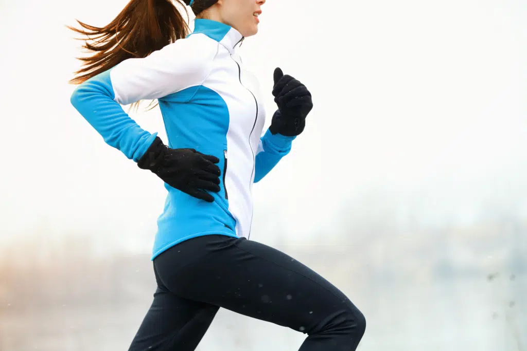 woman wearing running gloves in cold weather