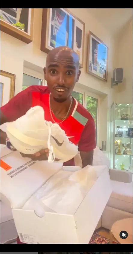 Mo Farah unboxes a pair of Nike running shoes.